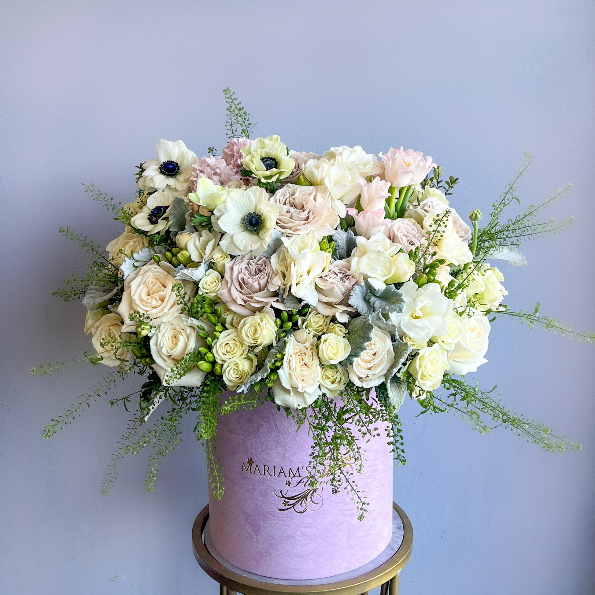 A purple box featuring white and pink floral designs, named "Moonlight Whisper."