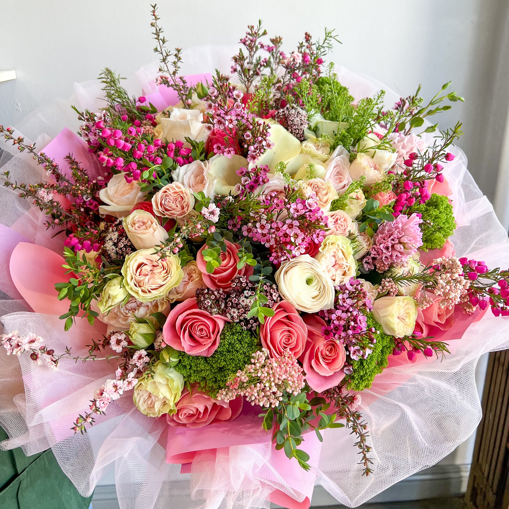 A stunning floral display with colorful flowers and soft moss, creating a natural and inviting centerpiece